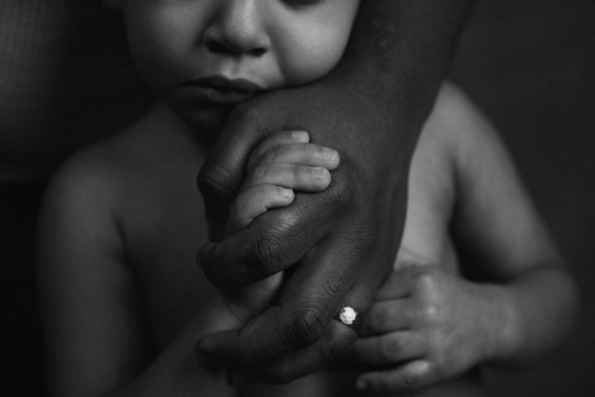 A close up of a childs hands with an adults